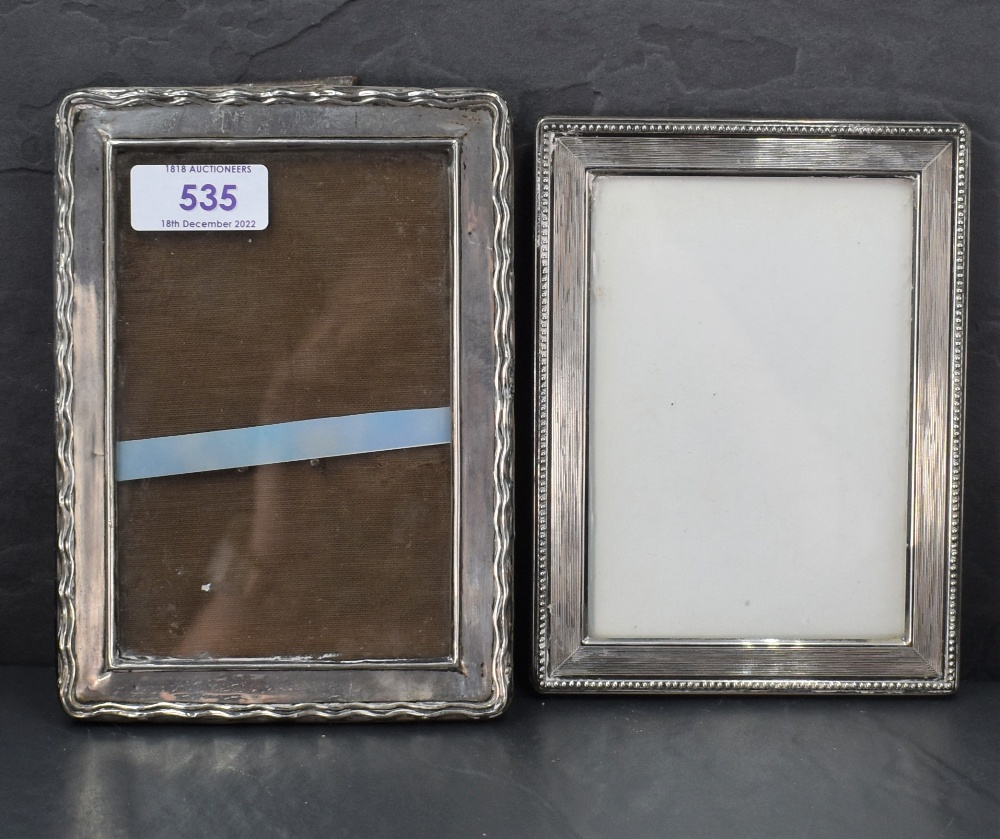 An imported 925 grade Sterling silver mounted photograph frame, of rectangular form with reeded
