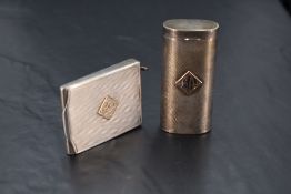 A silver match card holder having engine turned chequered decoration and bearing appliquéd