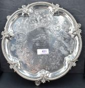 A Victorian silver salver having engraved scroll decoration with central inscription, pie crust