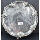 A Victorian silver salver having engraved scroll decoration with central inscription, pie crust