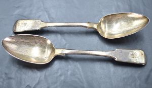 A pair of Georgian silver table spoons of fiddle back form bearing monogram to terminals, London