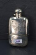 An Edwardian silver spirit flask of plain form with engraved monogram to side, bayonet lid and