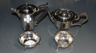 A silver matched bachelor teapot and sugar bowl of plain circular form with frilled rims, soft