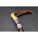 A Victorian white metal mounted and horn handled hawthorn walking cane, the scroll embossed white