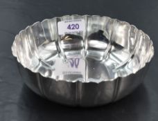 A 1940's silver bowl, of circular form with stylised petal form flutes, marks for London 1944,