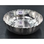 A 1940's silver bowl, of circular form with stylised petal form flutes, marks for London 1944,