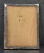 A George V silver photograph frame, of plain rectangular form, marks for Birmingham 1922, makers