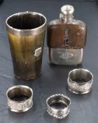A small selection of silver and white metal including three napkin rings, an Edwardian glass and