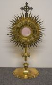 A fine and impressive George V silver gilt Monstrance or Ostensorium, the cruciform surmount centred