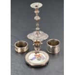 A small selection of HM silver including petit candle stick, two napkin rings, miniature trophy