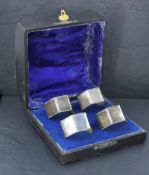 A 1940's four piece silver-mounted dressing table set, comprising a hand mirror, hair brush, clothes