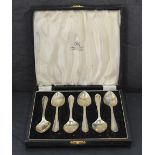 A cased set of six silver egg spoons having moulded detail to terminals, Sheffield 1945, G W