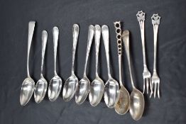 A group of mixed silver flatware, comprising spoons and two pickle forks, various dates, styles