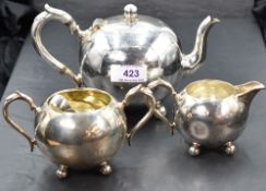 A small Victorian silver three piece breakfast set of plain spherical form with trefoil bun feet,