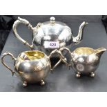 A small Victorian silver three piece breakfast set of plain spherical form with trefoil bun feet,