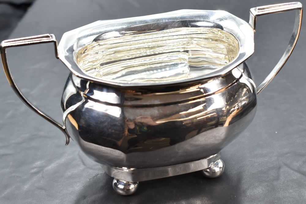 A matching silver cream jug and sugar bowl of oval form with architectural handles and bun feet, - Image 4 of 5