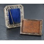 Two small silver photograph frames, one having plain frame with wooden easel back, London 1922,