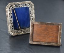 Two small silver photograph frames, one having plain frame with wooden easel back, London 1922,