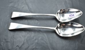 A pair of George III silver Old English pattern table spoons, each with Hanovarian reverse and