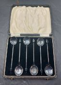 A cased set of six George VI silver coffee bean spoons, each of traditional form with fluted