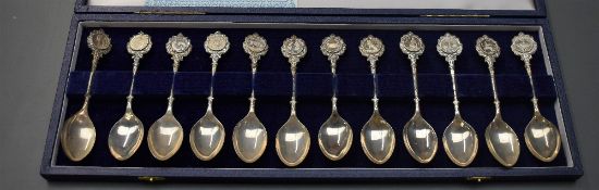 A set of 12 John Pinches Silver Zodiac Spoons, with certificate in case and outer card box