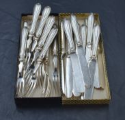 A ten place set of silver handled dessert knives and forks of plain form, Sheffield 1921, Yates