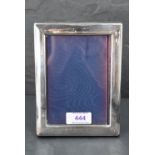 An Elizabeth II silver-mounted photograph frame, of plain rectangular form, marks for Sheffield