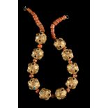 ˜A GOLD AND CORAL NECKLACE, TIBET, 18TH CENTURY OR EARLIER