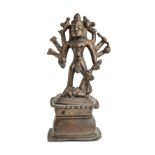 A FOLK BRONZE FIGURE OF DURGA SLAYING THE BUFFALO DEMON, WESTERN DECCAN, 18TH / 19TH CENTURY