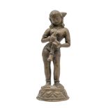 A BRONZE FIGURE OF A FEMALE TRUMPETER, NEPAL, 20TH CENTURY