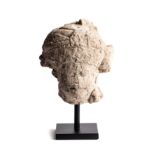 A MAJAPAHIT PUMICE HEAD OF A RULER, JAVA, INDONESIA, CIRCA 14TH CENTURY
