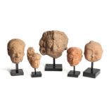 FIVE SMALL MAJAPAHIT TERRACOTTA HEADS, JAVA, 14TH CENTURY