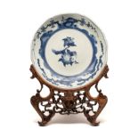A JAPANESE BLUE AND WHITE KAKIEMON STYLE DISH, 18TH CENTURY