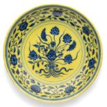 A CHINESE IMPERIAL YELLOW-GROUND BLUE AND WHITE 'LOTUS BOUQUET' DISH, YONGZHENG MARK AND PERIOD (172
