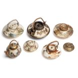 A GROUP OF SEVEN JAPANESE SATSUMA SMALL OR MINIATURE WINE POTS AND COVERS, 19TH / 20TH CENTURY