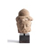 A MAJAPAHIT PUMICE HEAD OF A MAN, JAVA, INDONESIA, CIRCA 14TH CENTURY