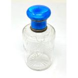 A FRENCH ENAMELLED SILVER AND GLASS DRESSING TABLE BOTTLE, CIRCA 1920