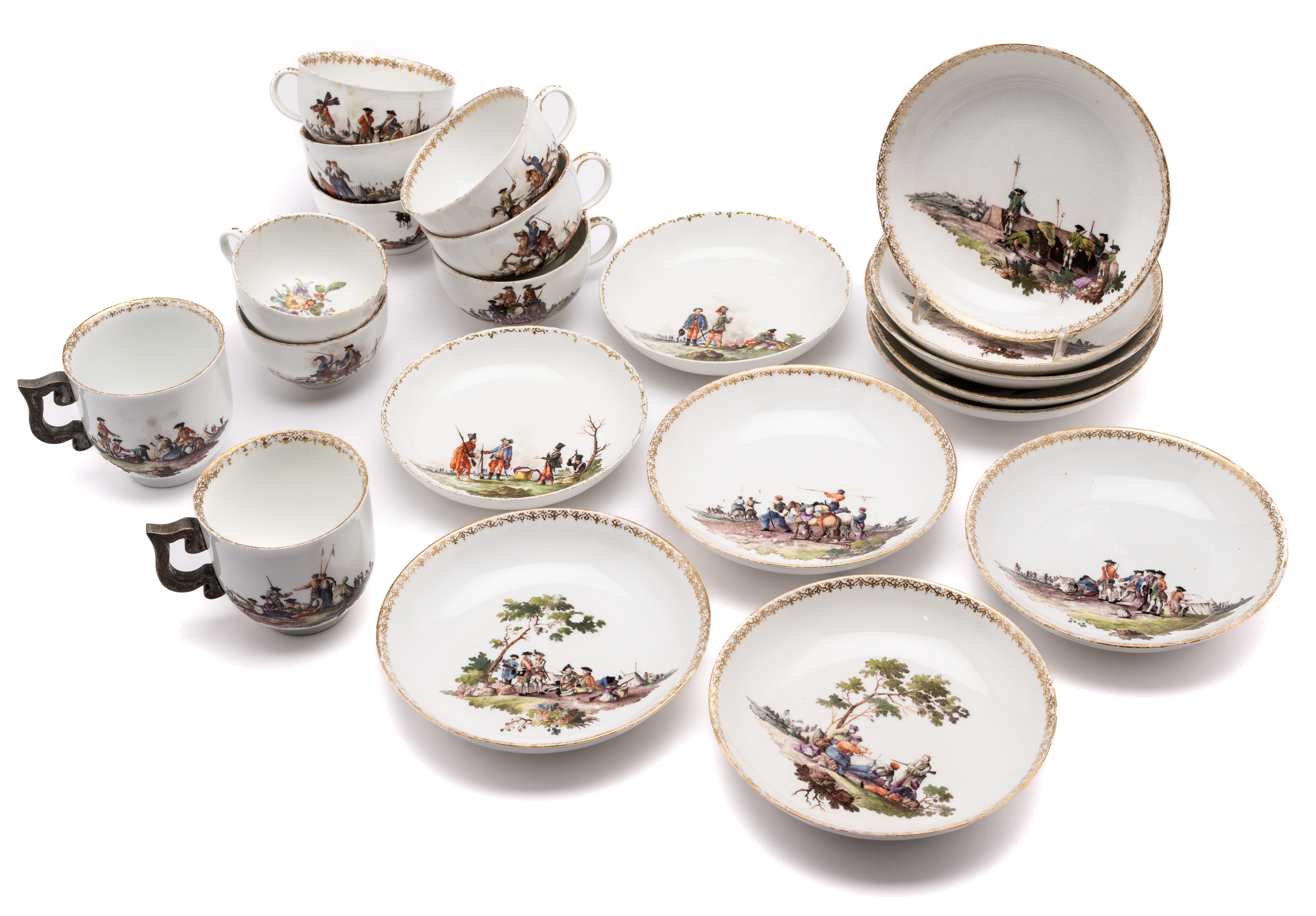 A MEISSEN 'BATAILLENMALEREI' GROUP OF TEN CUPS AND ELEVEN SAUCERS, MID 18TH CENTURY