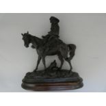 A SPELTER MODEL OF A MOUNTED CAVALIER