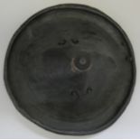 A NORTH AFRICAN BLACKENED HIDE CIRCULAR SHIELD, LATE 19TH CENTURY