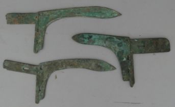 THREE CHINESE BRONZE HALBERDS, PROBABLY ZHOU DYNASTY OR EARLY WARRING STATES