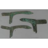 THREE CHINESE BRONZE HALBERDS, PROBABLY ZHOU DYNASTY OR EARLY WARRING STATES