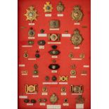 A GROUP OF ROYAL MARINES LIGHT INFANTRY HEADDRESS PLATES, CAP AND COLLAR BADGES