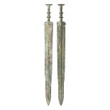 TWO CHINESE BRONZE SWORDS (JIAN), PROBABLY ZHOU DYNASTY OR EARLY WARRING STATES (1050-221 BC) AND TW