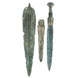 A BRONZE DAGGER, PROBABALY LURISTAN 3RD CENTURY B.C., NINE FURTHER BRONZE DAGGER BLADES AND A SPEARH