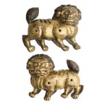 A PAIR OF COPPER-GILT RELIEFS OF LIONS