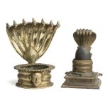 TWO BRASS LINGAM HOLDERS