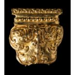 A FRAGMENTARY GOLD REPOUSSE 'TIGER CLAW' PENDANT