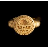 A GOLD SEAL RING
