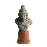 A PALLAVA GRANITE BUST OF A MALE DEITY